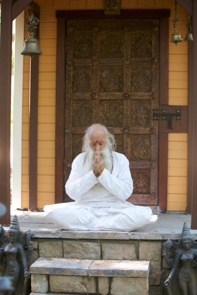 1587673011505_Swami-meditaing-at-Mukambika-temple-by-Amy-Carr.jpg